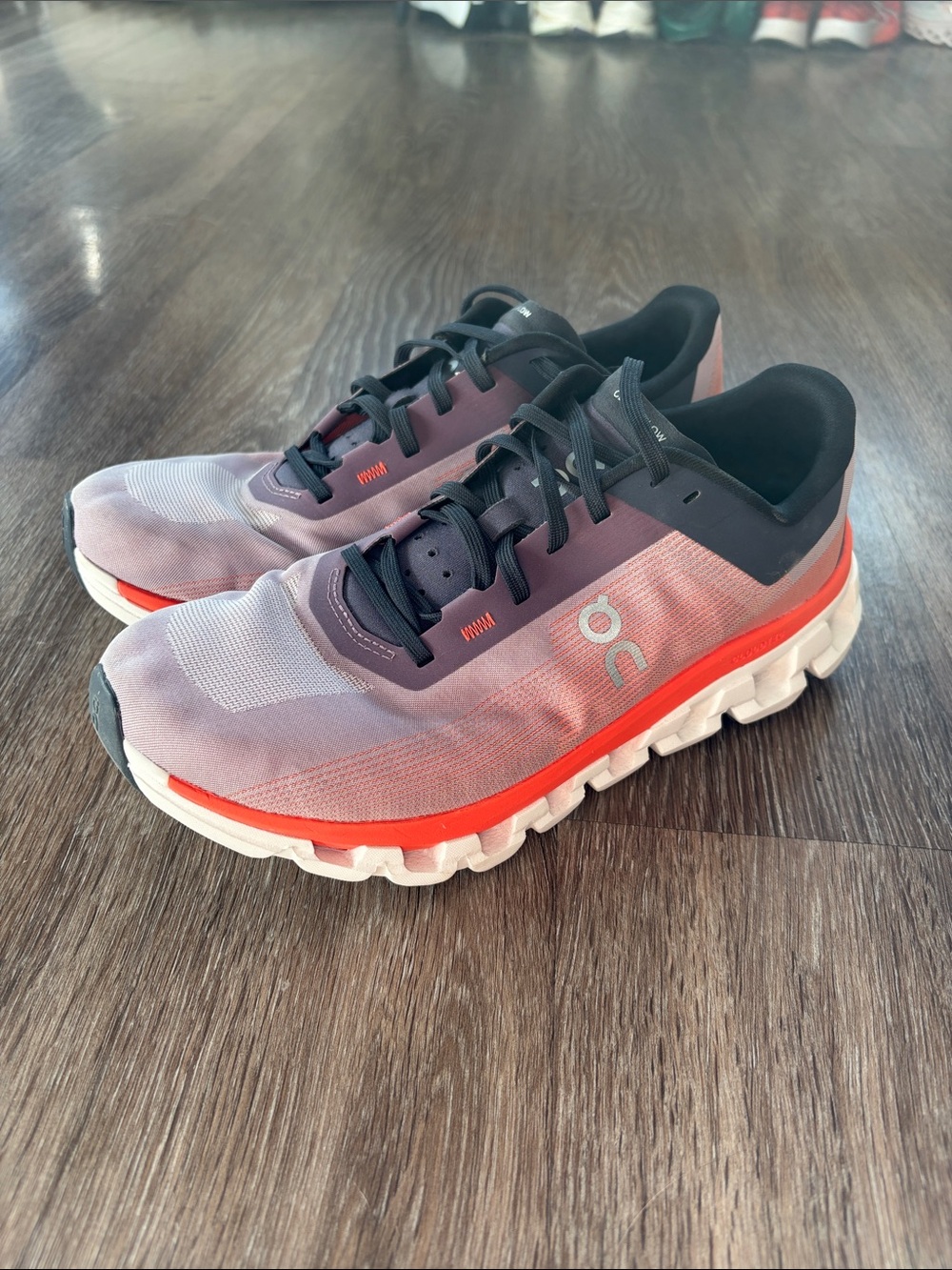 On Cloudflow Women’s Athletic Shoes in Purple and Coral